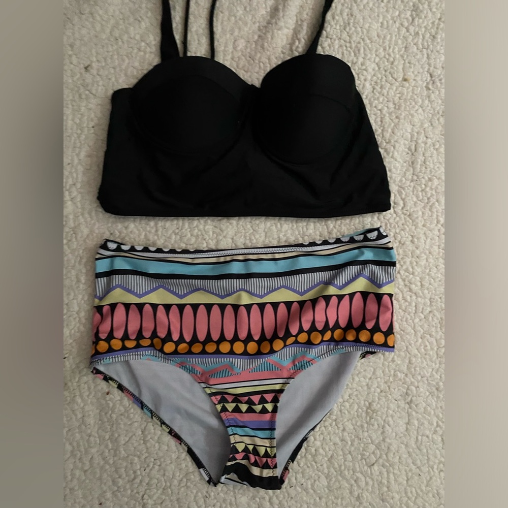 Large black top colorful bottoms swim suit